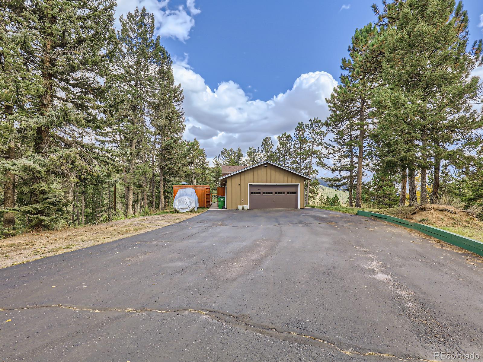 24697 Red Cloud Drive Conifer, CO 80433 - Photo 28 of 28 a view of a house with a yard