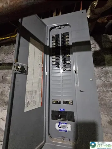 a view of a backyard with wooden fence