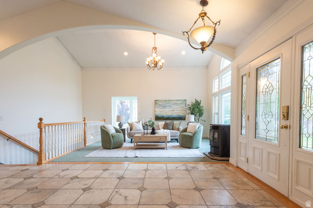 875 East 1300th Street North Mapleton, UT 84664 - Photo 11 of 65 Entrance foyer featuring crown molding, a chandelier, vaulted ceiling, and arched walkways