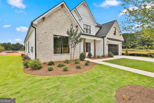a front view of a house with garden