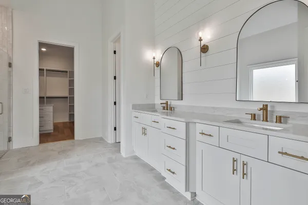 a spacious bathroom with a bathtub and shower
