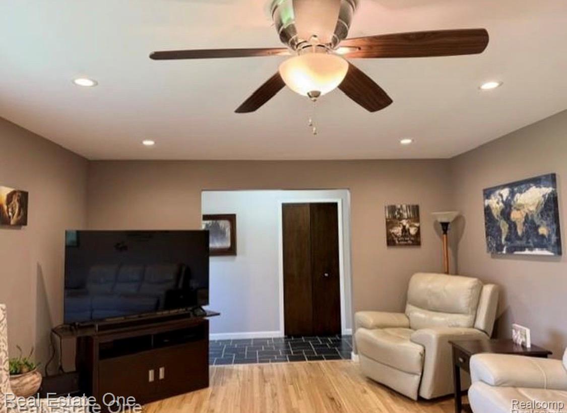 1115 Torpey Road Troy, MI 48083 - Photo 17 of 38 Living area featuring wood-finish flooring, recessed lighting, and a ceiling fan with integrated lighting