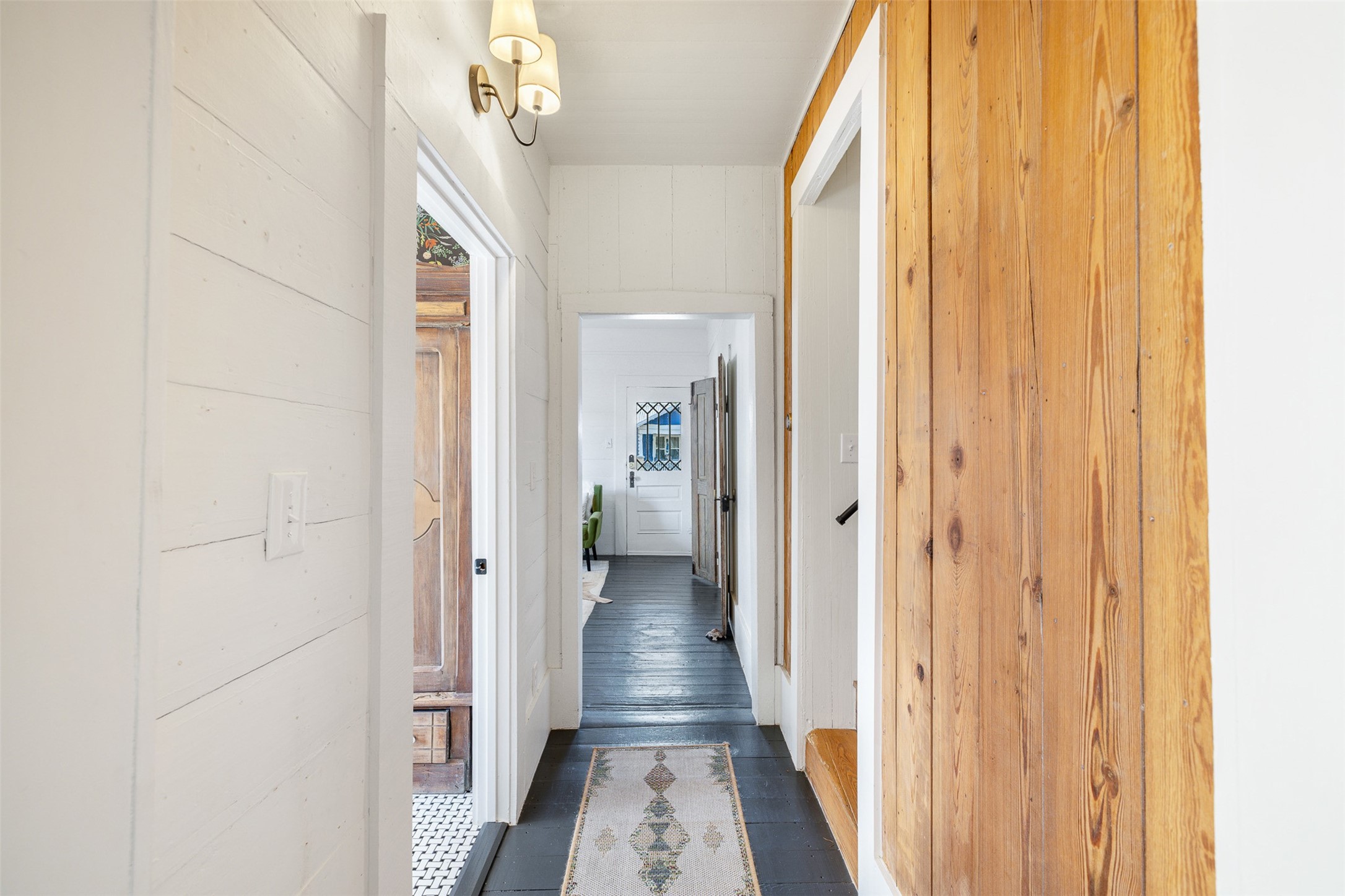206 North Rusk Street Fayetteville, TX 78940 - Photo 12 of 50 a view of a hallway with wooden floor and staircase