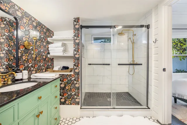 a bathroom with a shower and a sink