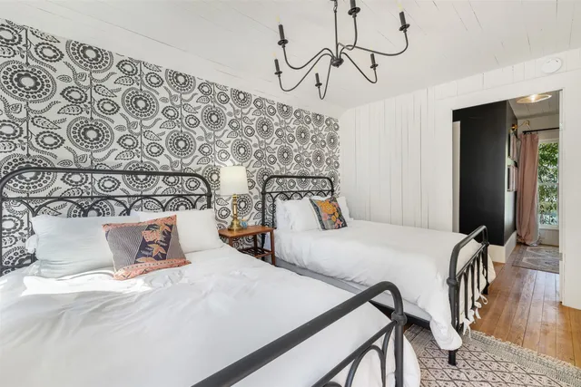 a bedroom with bed and window