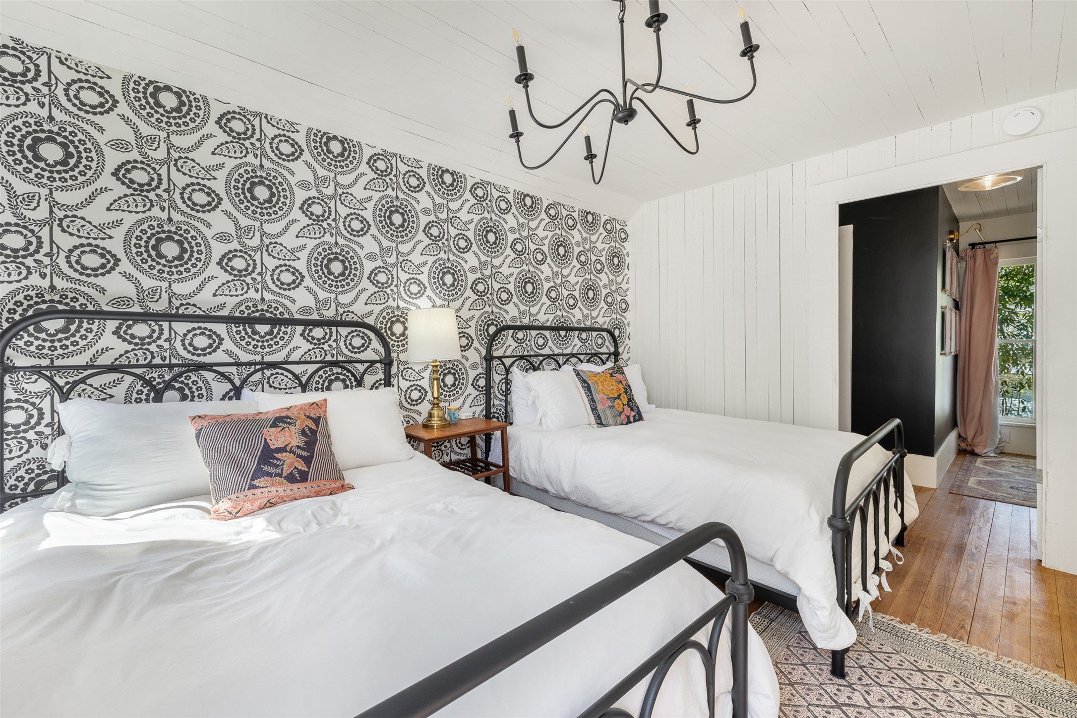 206 North Rusk Street Fayetteville, TX 78940 - Photo 26 of 50 a bedroom with a bed and wooden floor