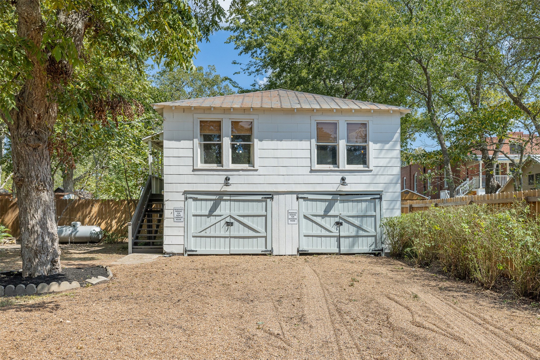 206 North Rusk Street Fayetteville, TX 78940 - Photo 30 of 50 a front view of a house with a yard and garage