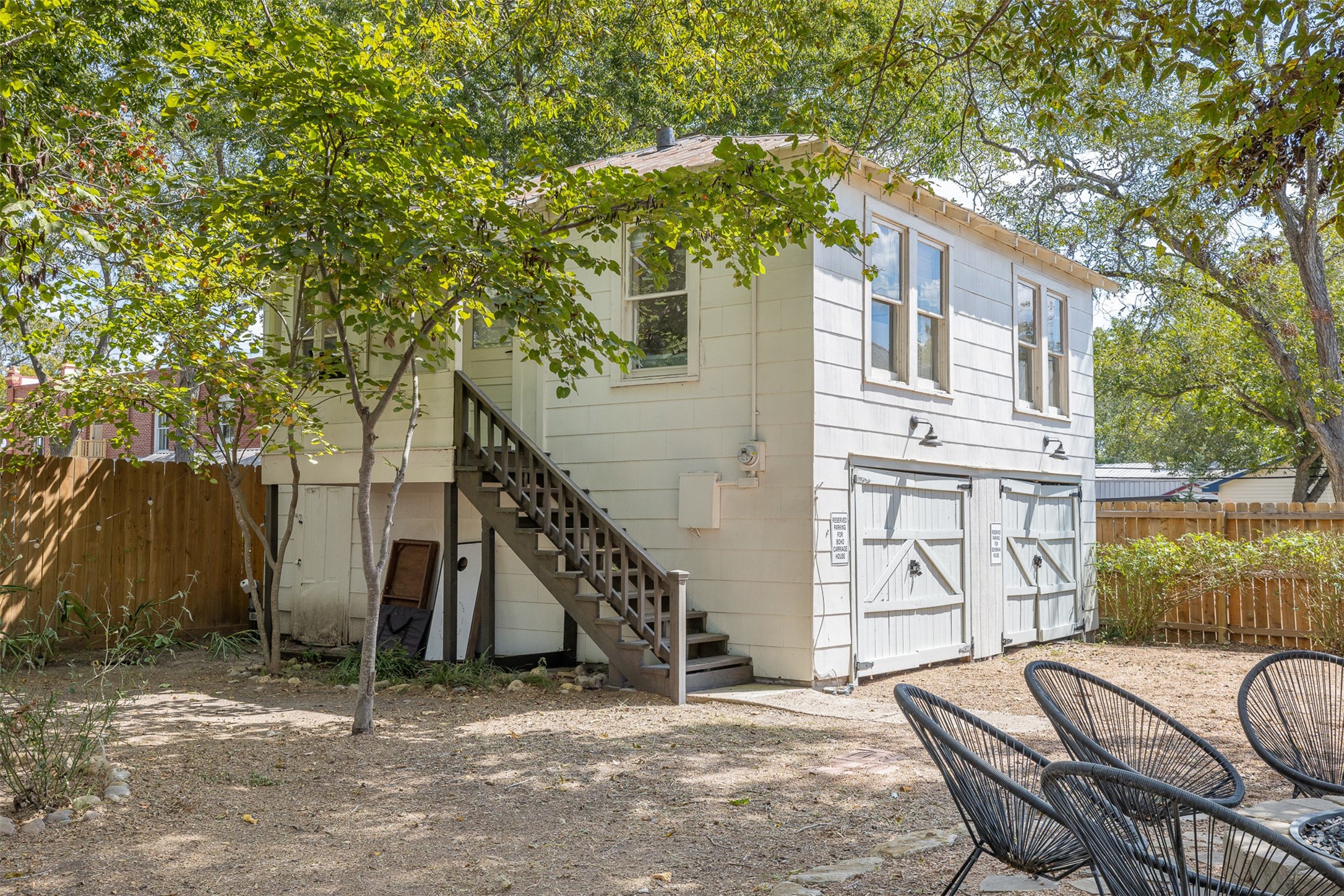 206 North Rusk Street Fayetteville, TX 78940 - Photo 32 of 50 a backyard of a house with seating space
