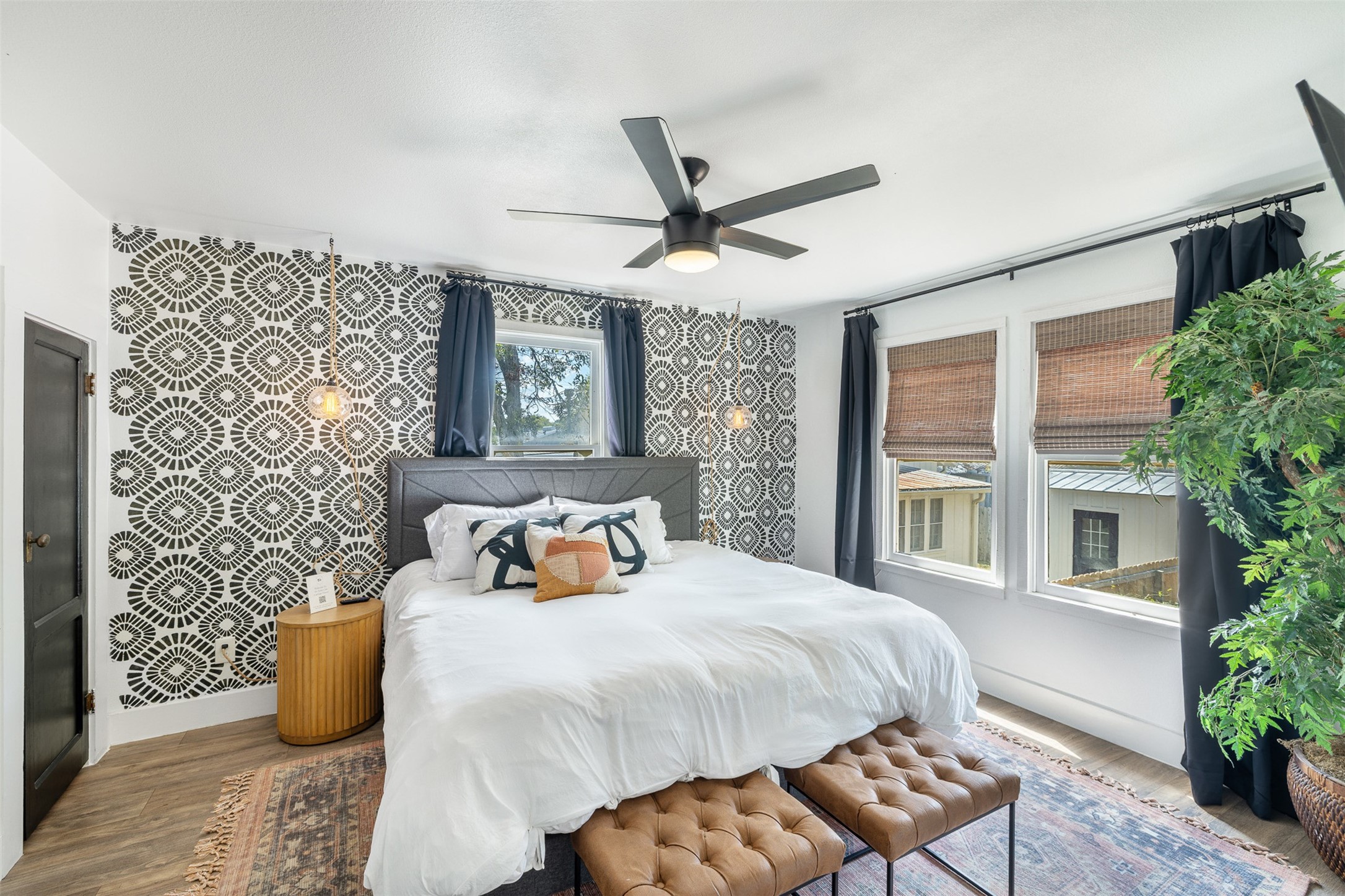 206 North Rusk Street Fayetteville, TX 78940 - Photo 38 of 50 a bedroom with a bed and wooden floor