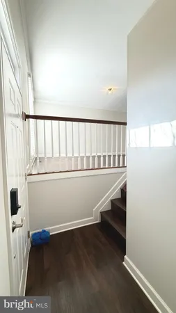 a view of entryway with wooden floor
