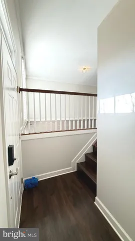 a view of entryway with wooden floor