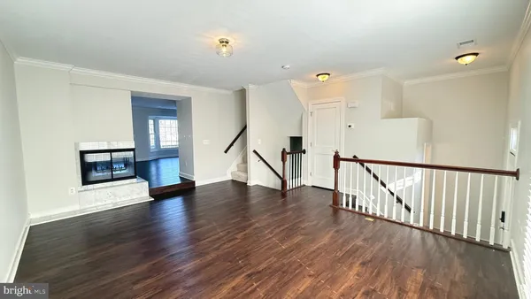 a view of an entryway with wooden floor