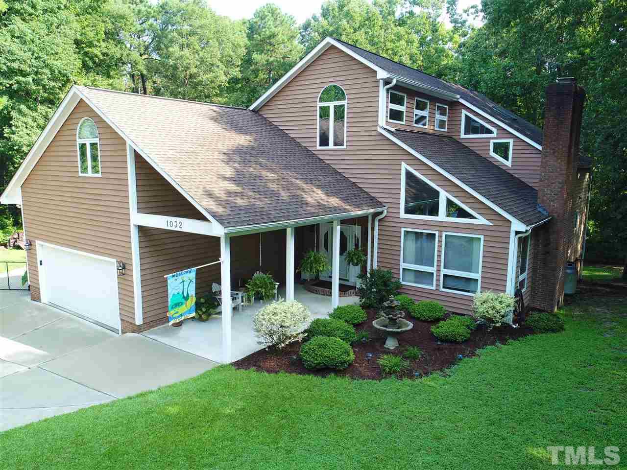 1032 Ridge Drive Clayton, NC 27520 - Photo 1 of 25 a front view of a house with a yard and porch