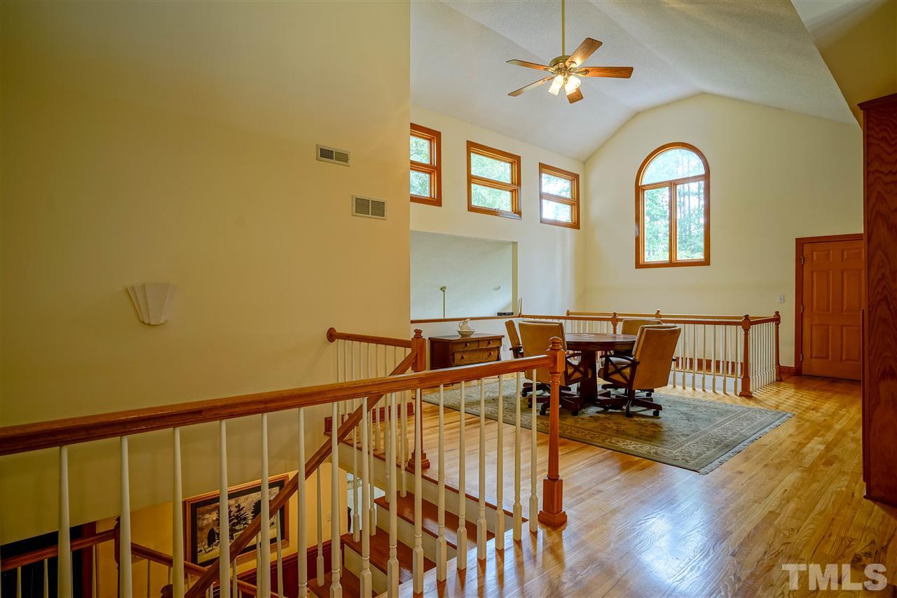 1032 Ridge Drive Clayton, NC 27520 - Photo 13 of 25 a view of a dining room with furniture window and wooden floor