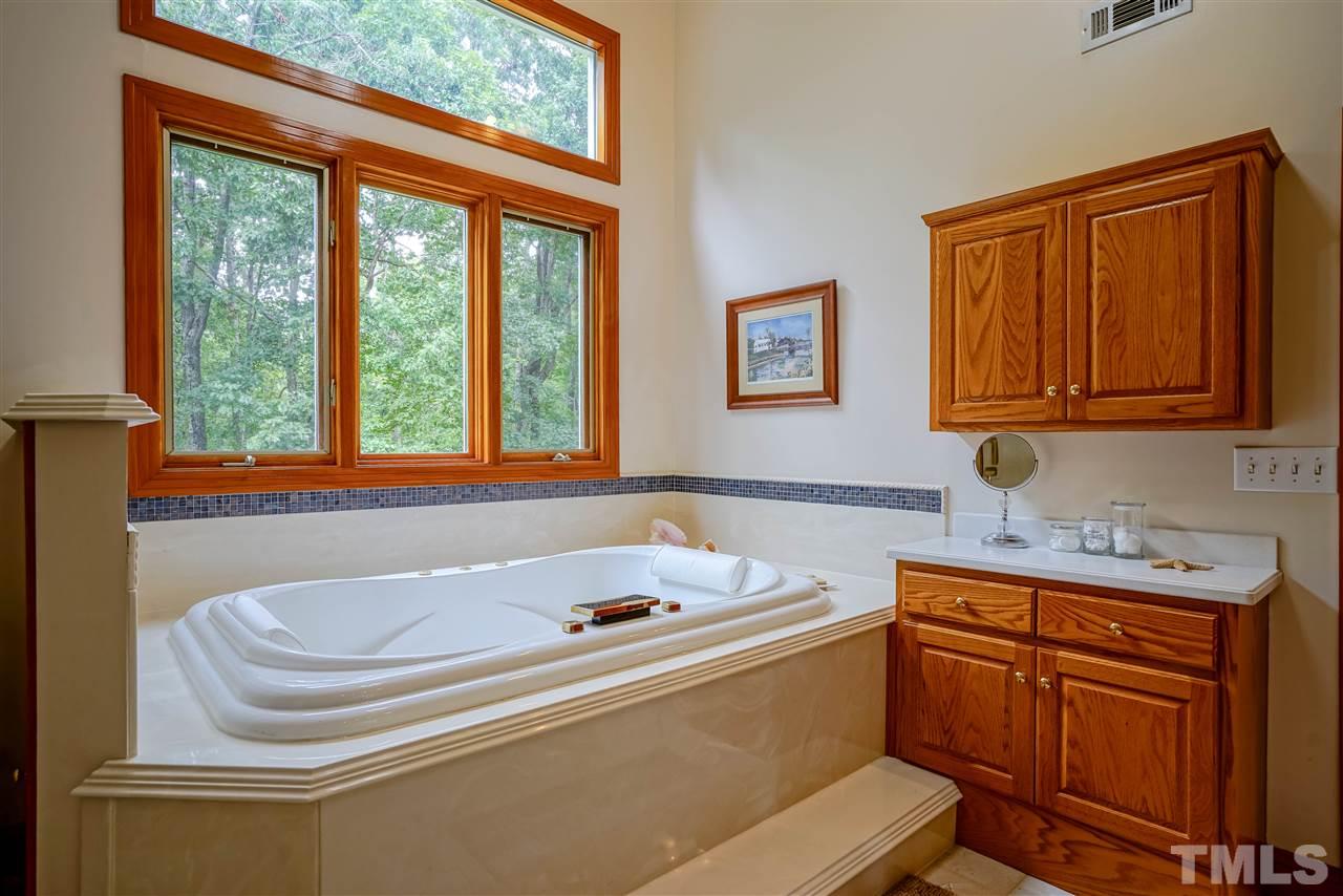 1032 Ridge Drive Clayton, NC 27520 - Photo 17 of 25 a bathroom with a sink and a bathtub