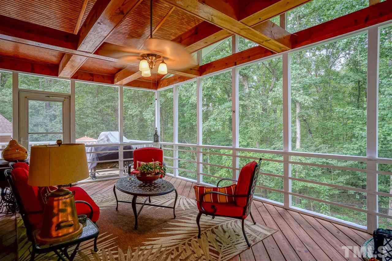 1032 Ridge Drive Clayton, NC 27520 - Photo 20 of 25 a patio with lawn chairs and wooden floor