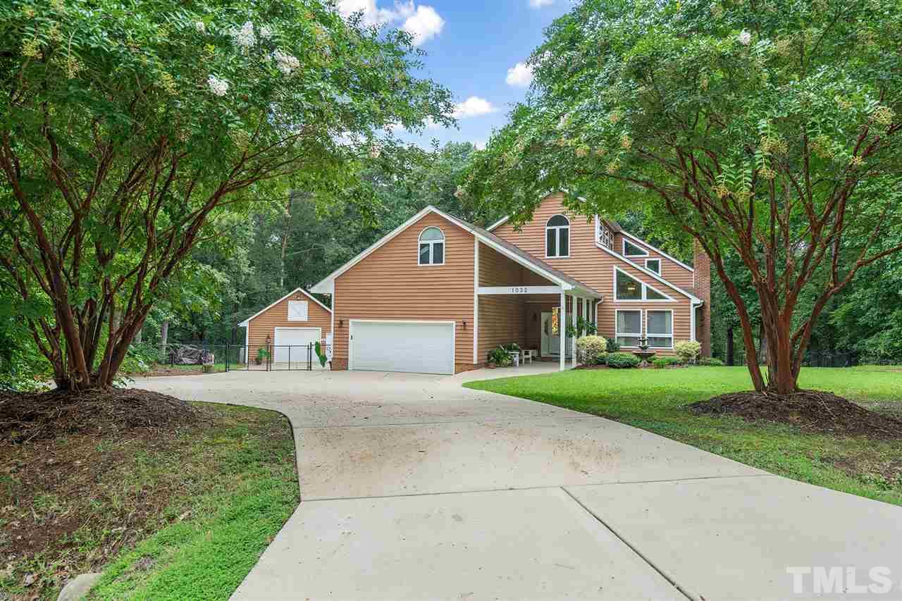 1032 Ridge Drive Clayton, NC 27520 - Photo 24 of 25 a front view of a house with a yard and trees