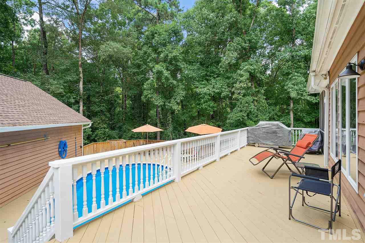1032 Ridge Drive Clayton, NC 27520 - Photo 25 of 25 a view of balcony with two chairs and a table