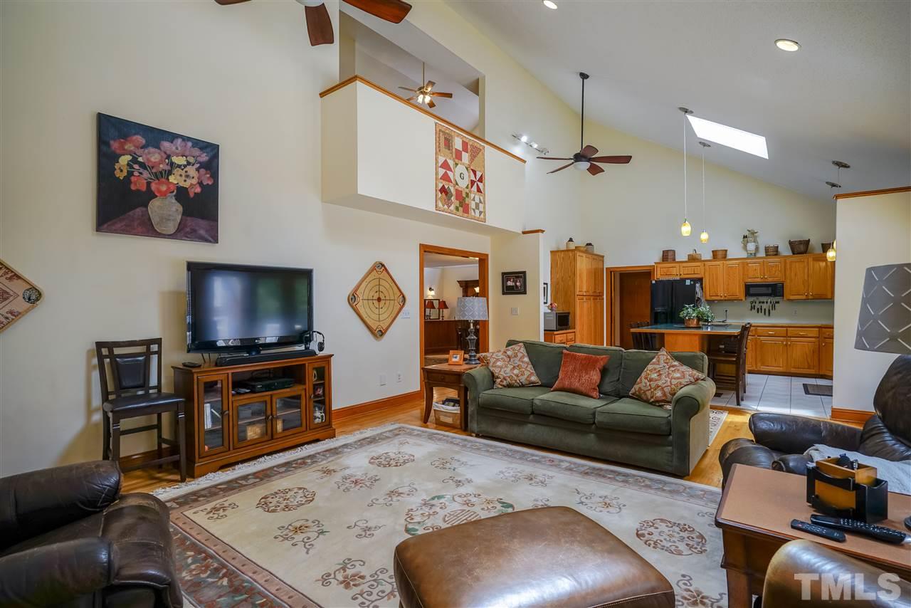 1032 Ridge Drive Clayton, NC 27520 - Photo 4 of 25 a living room with furniture and a flat screen tv