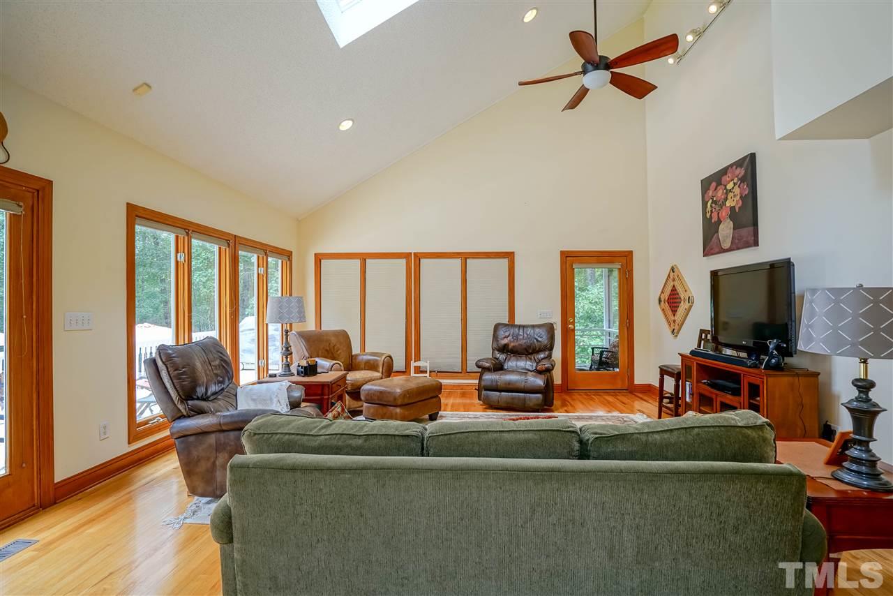 1032 Ridge Drive Clayton, NC 27520 - Photo 7 of 25 a living room with furniture and a flat screen tv