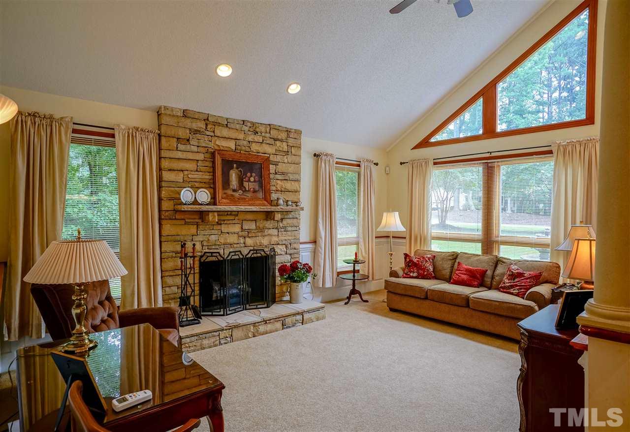 1032 Ridge Drive Clayton, NC 27520 - Photo 9 of 25 a living room with furniture and a fireplace