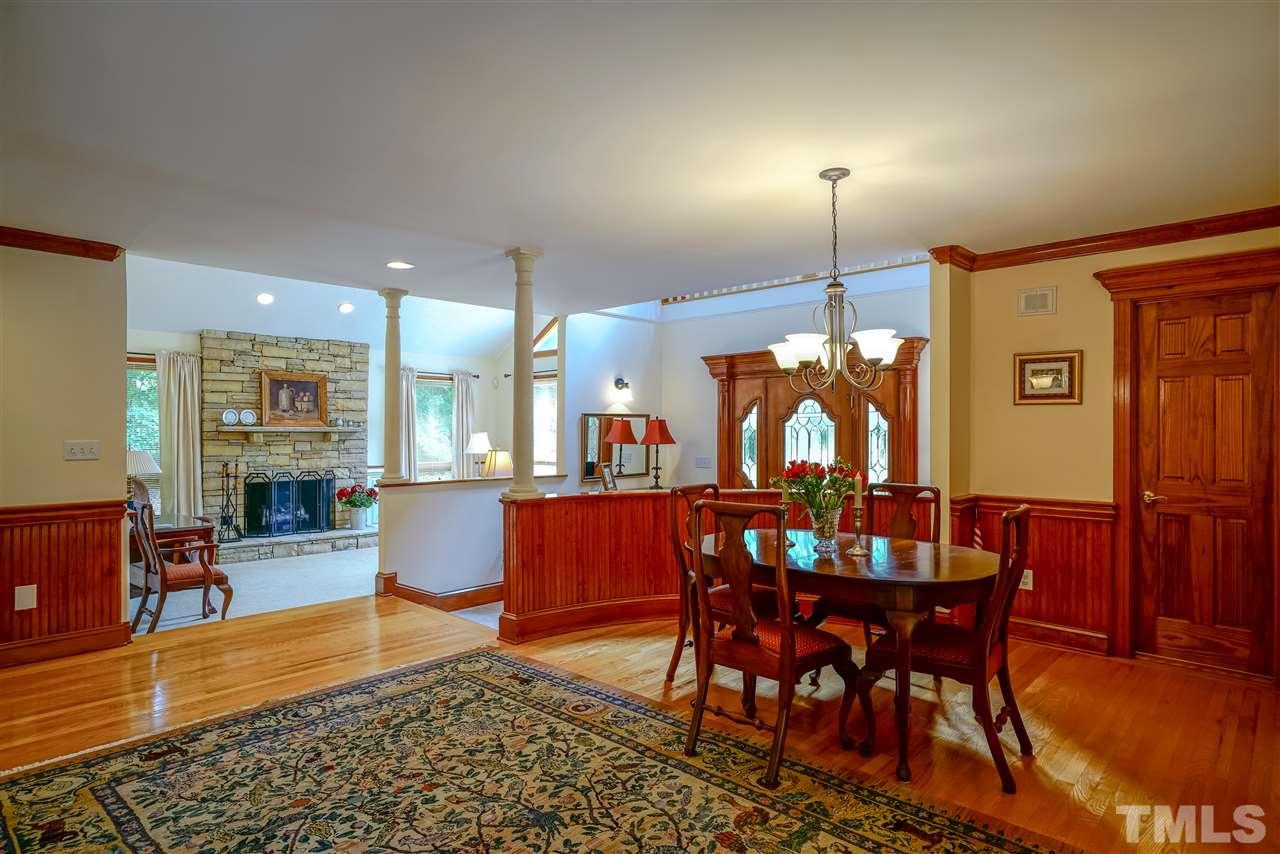 1032 Ridge Drive Clayton, NC 27520 - Photo 10 of 25 a living room with dining room and wooden floor