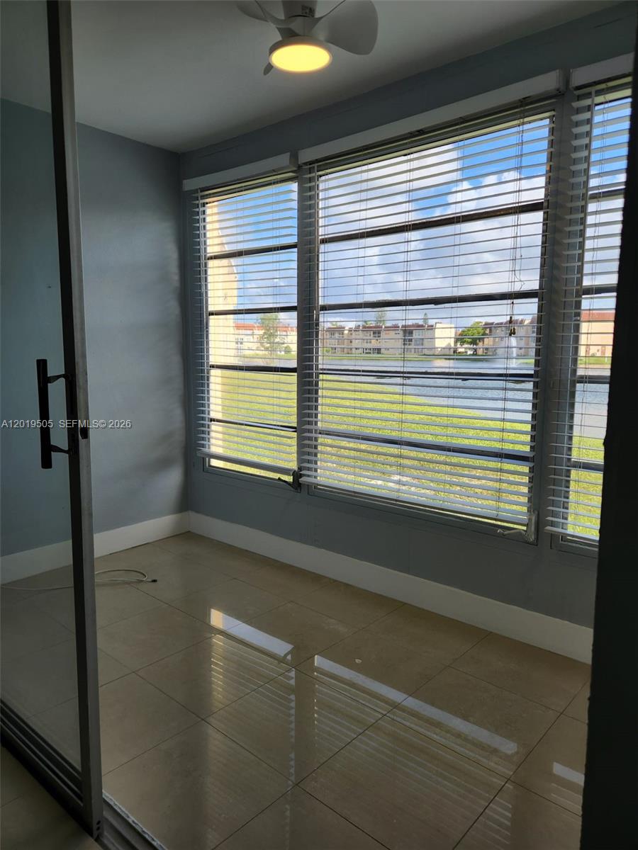 2811 North Pine Island Road, Unit 107 Sunrise, FL 33322 - Photo 15 of 16 a bathroom with a window and a shower
