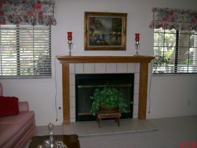 226 Summit Station Road Arroyo Grande, CA 93420 - Photo 14 of 25 a living room with furniture and a fireplace