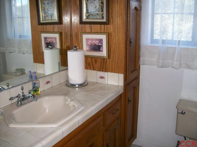 226 Summit Station Road Arroyo Grande, CA 93420 - Photo 23 of 25 a bathroom with a sink and a mirror