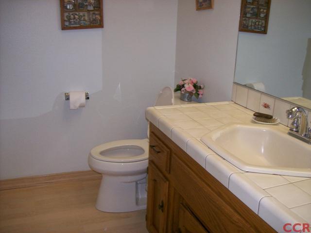 226 Summit Station Road Arroyo Grande, CA 93420 - Photo 24 of 25 a bathroom with a sink a toilet and a mirror