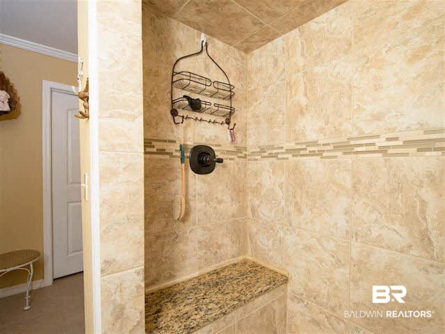 640 Spanish Main Spanish Fort, AL 36527 - Photo 17 of 33 Downstairs master offers granite counter tops, large walk in tiled shower with bench.