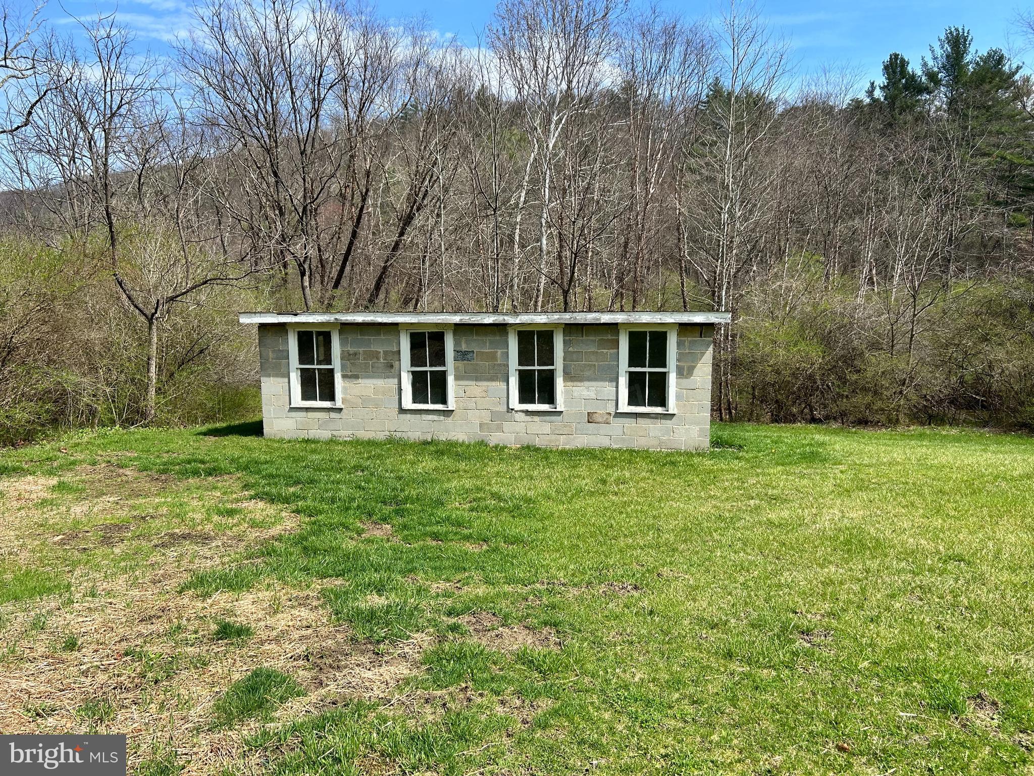 1150 Purcell Road Artemas, PA 17211 - Photo 11 of 19 a front view of a house with a garden