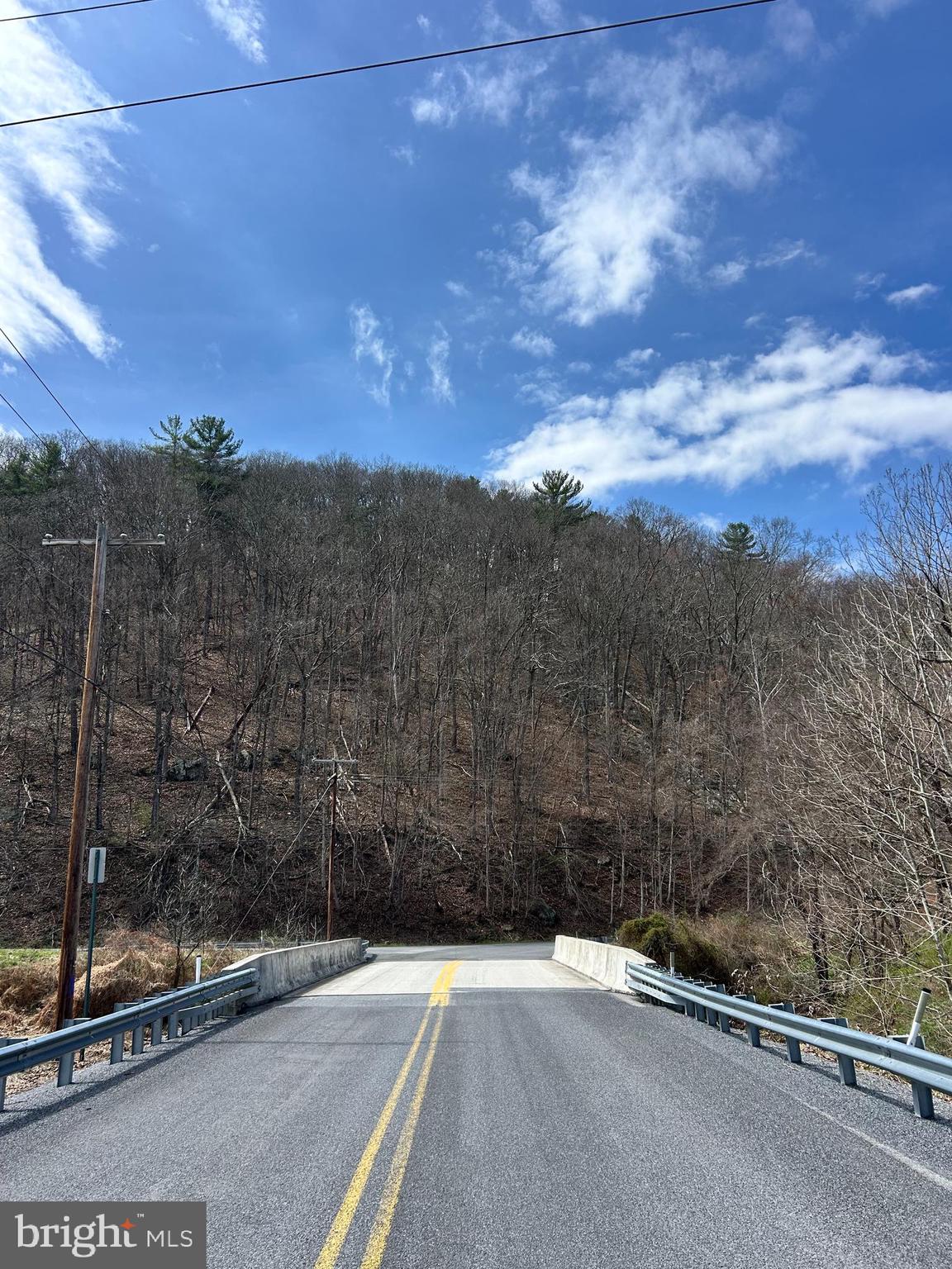 1150 Purcell Road Artemas, PA 17211 - Photo 15 of 19 a view of a road with a building in the background
