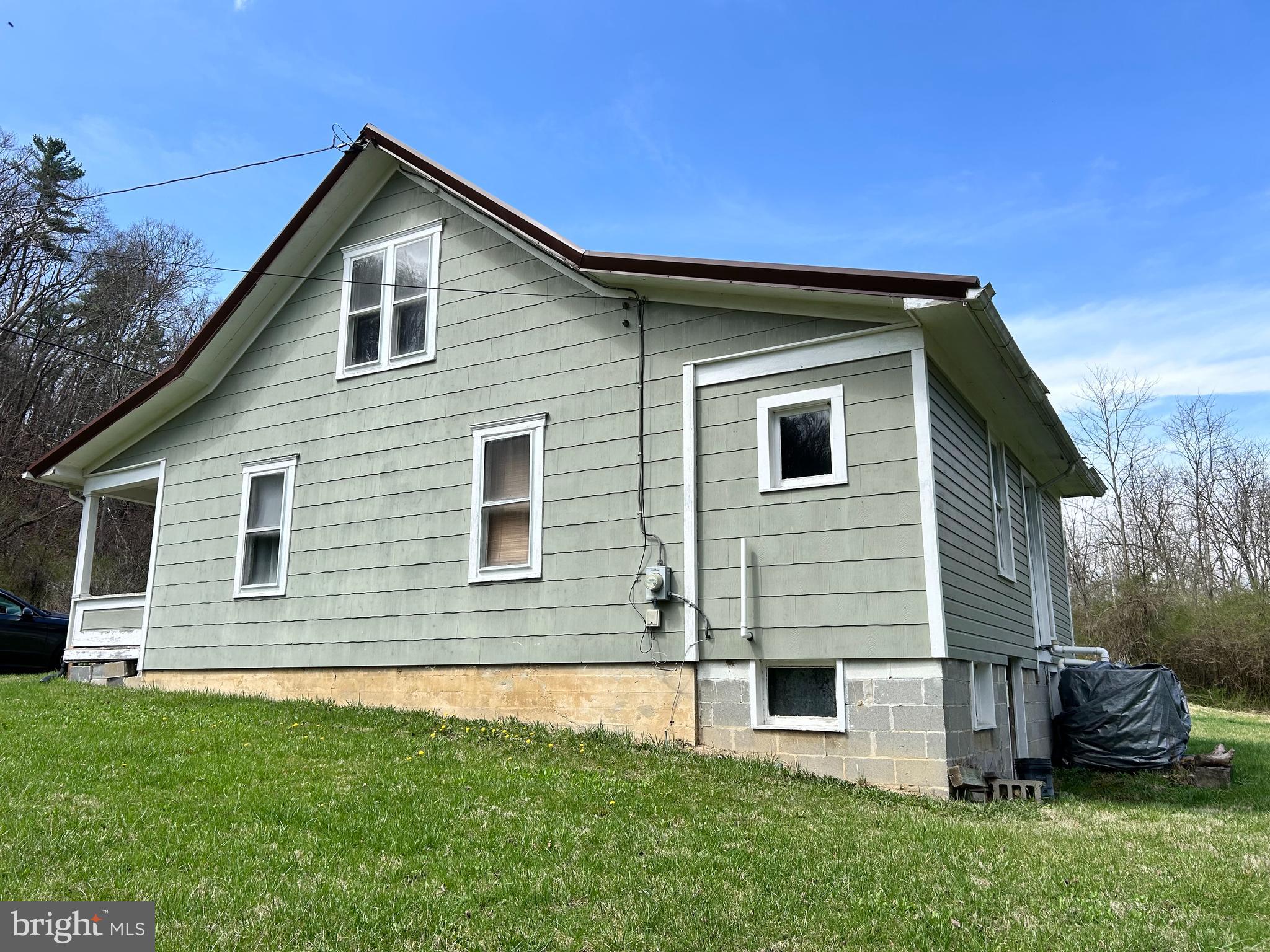 1150 Purcell Road Artemas, PA 17211 - Photo 10 of 19 a front view of a house with a garden