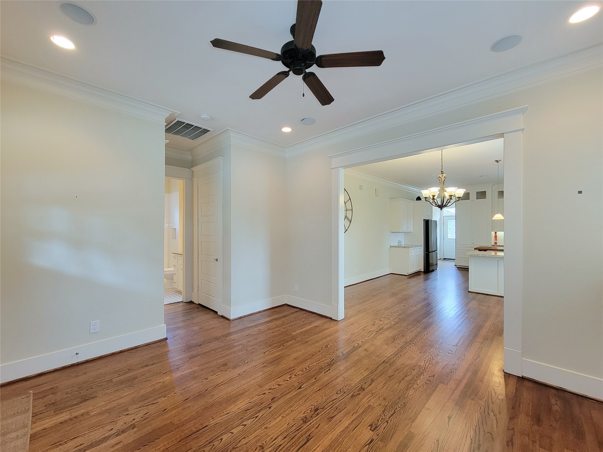 1140 West Cottage Street Houston, TX 77009 - Photo 7 of 37 a view of an empty room and wooden floor