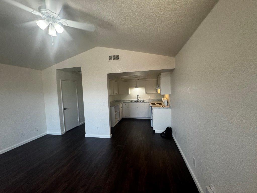 1405 East Cypress Avenue Reedley, CA 93654 - Photo 23 of 29 a view of empty room with wooden floor