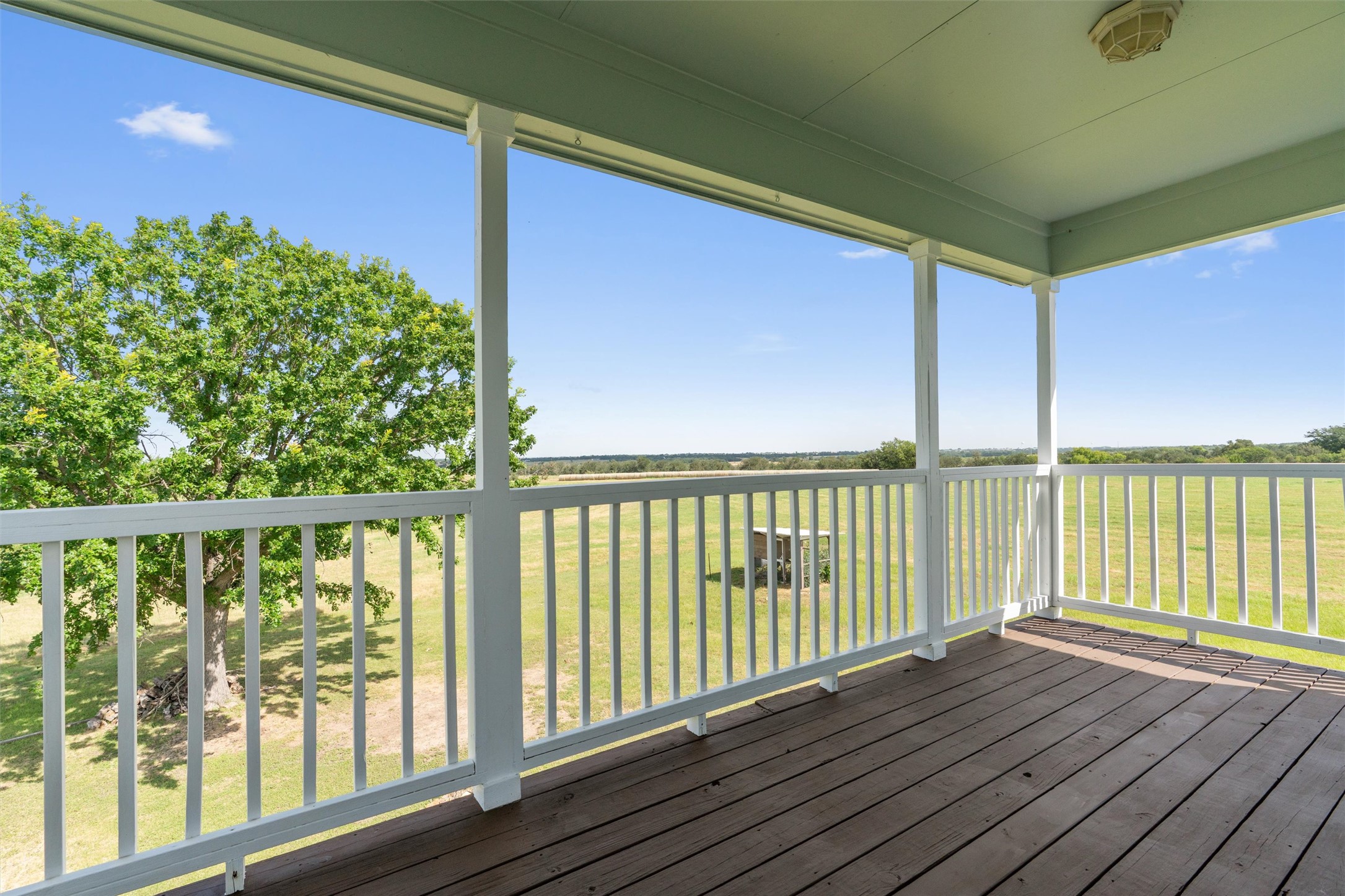 768 Upper Elgin River Road Elgin, TX 78621 - Photo 17 of 40 Balcony connected to the primary bedroom.