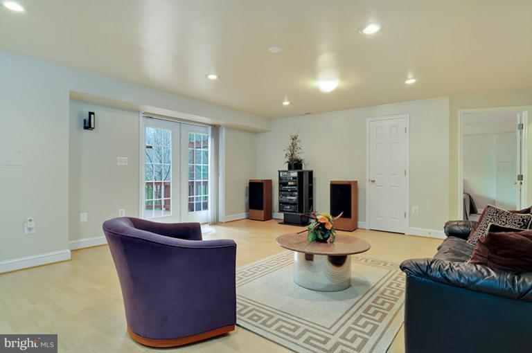 6126 Garden Road Springfield, VA 22152 - Photo 22 of 30 a living room with furniture a flat screen tv and a window