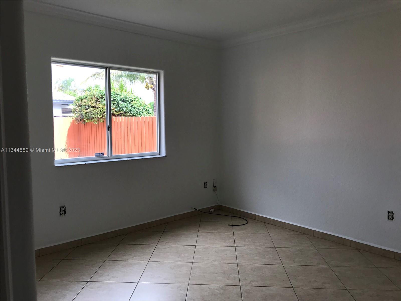 16057 Southwest 53rd Terrace Miami, FL 33185 - Photo 16 of 30 a view of a room that has a window in it