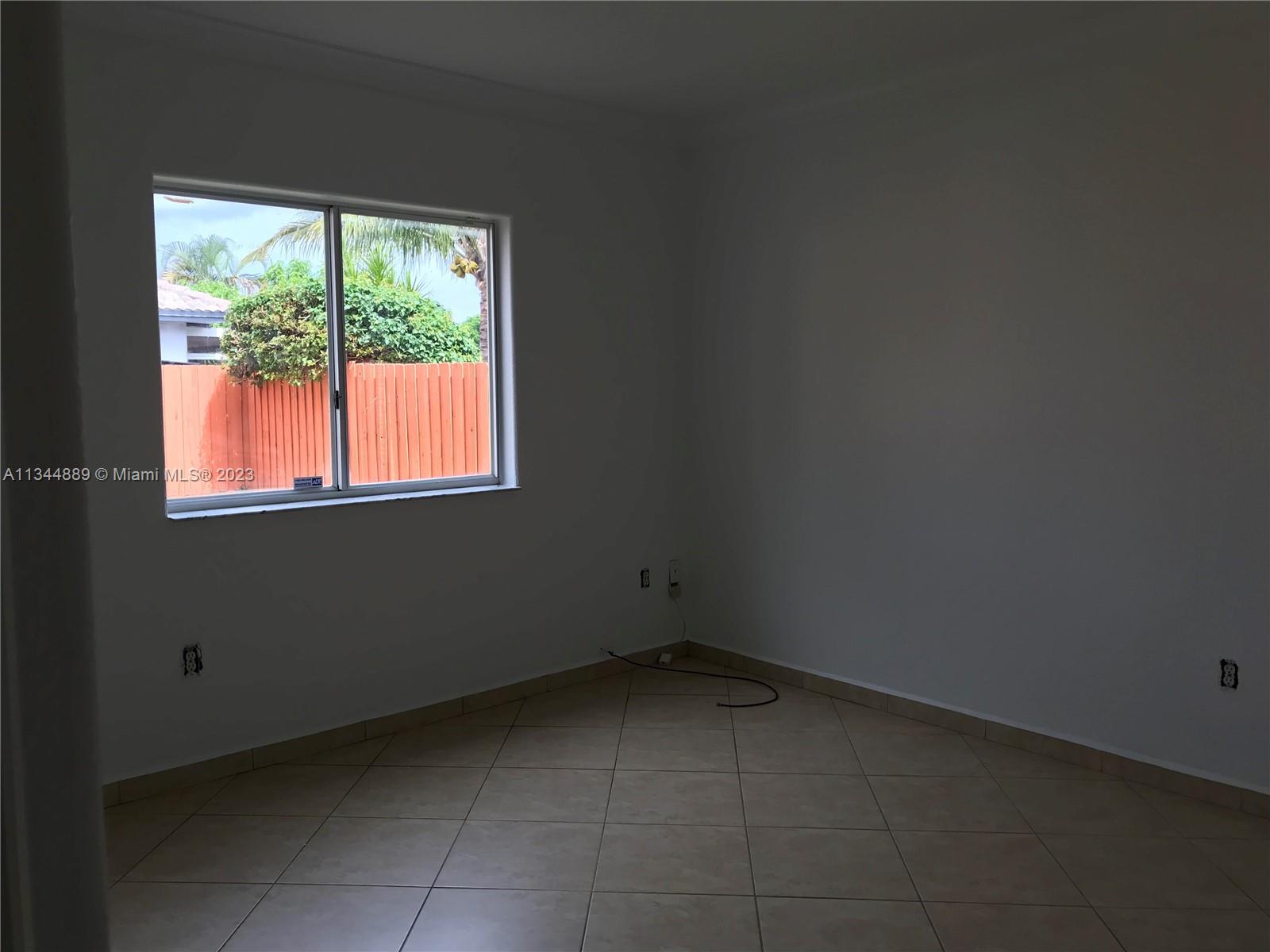 16057 Southwest 53rd Terrace Miami, FL 33185 - Photo 17 of 30 a view of a room that has a window in it