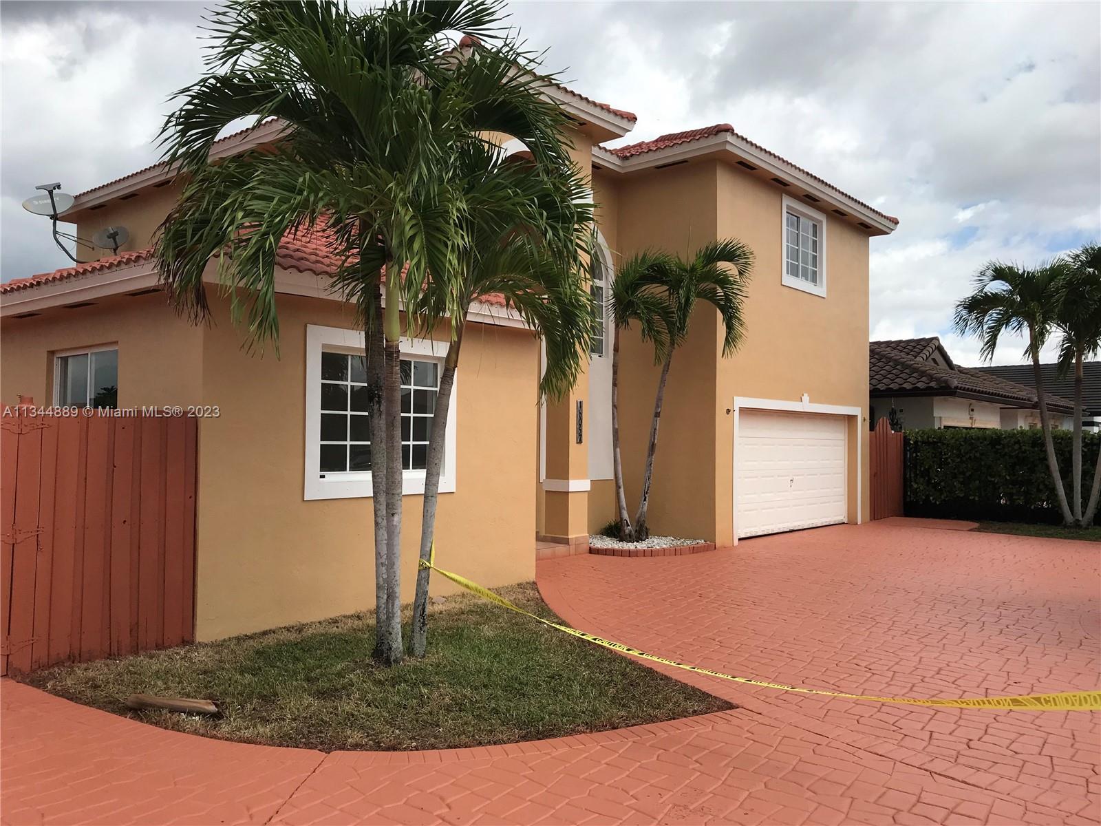 16057 Southwest 53rd Terrace Miami, FL 33185 - Photo 2 of 30 a view of a house with a yard