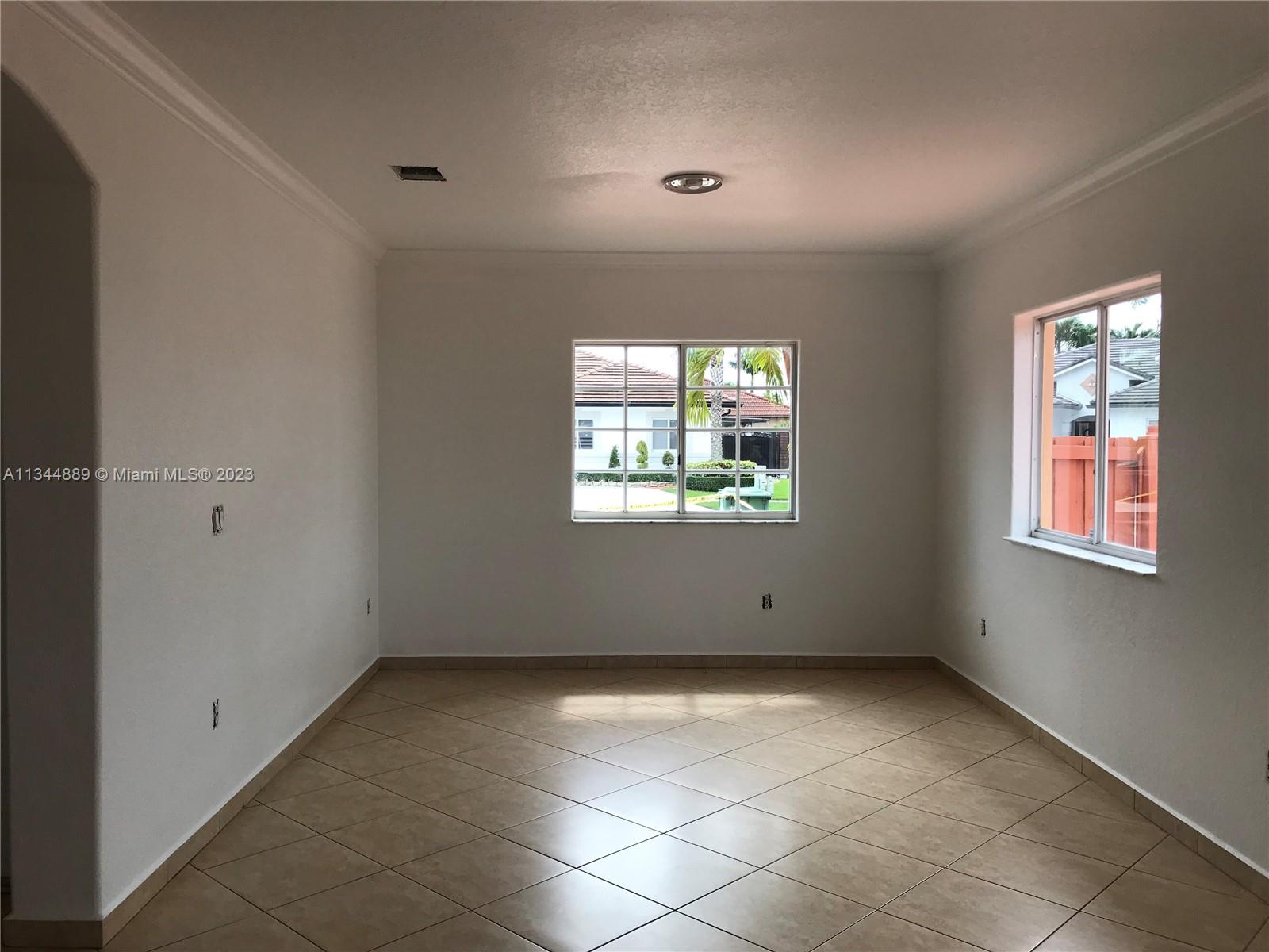 16057 Southwest 53rd Terrace Miami, FL 33185 - Photo 7 of 30 an empty room with windows