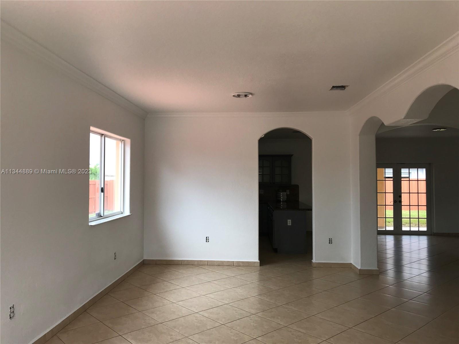 16057 Southwest 53rd Terrace Miami, FL 33185 - Photo 8 of 30 an empty room with windows and closet