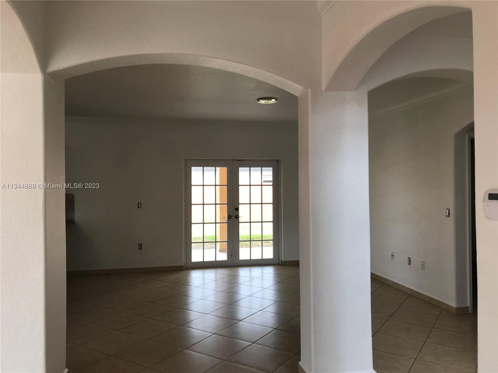 16057 Southwest 53rd Terrace Miami, FL 33185 - Photo 9 of 30 a view of an empty room with a window