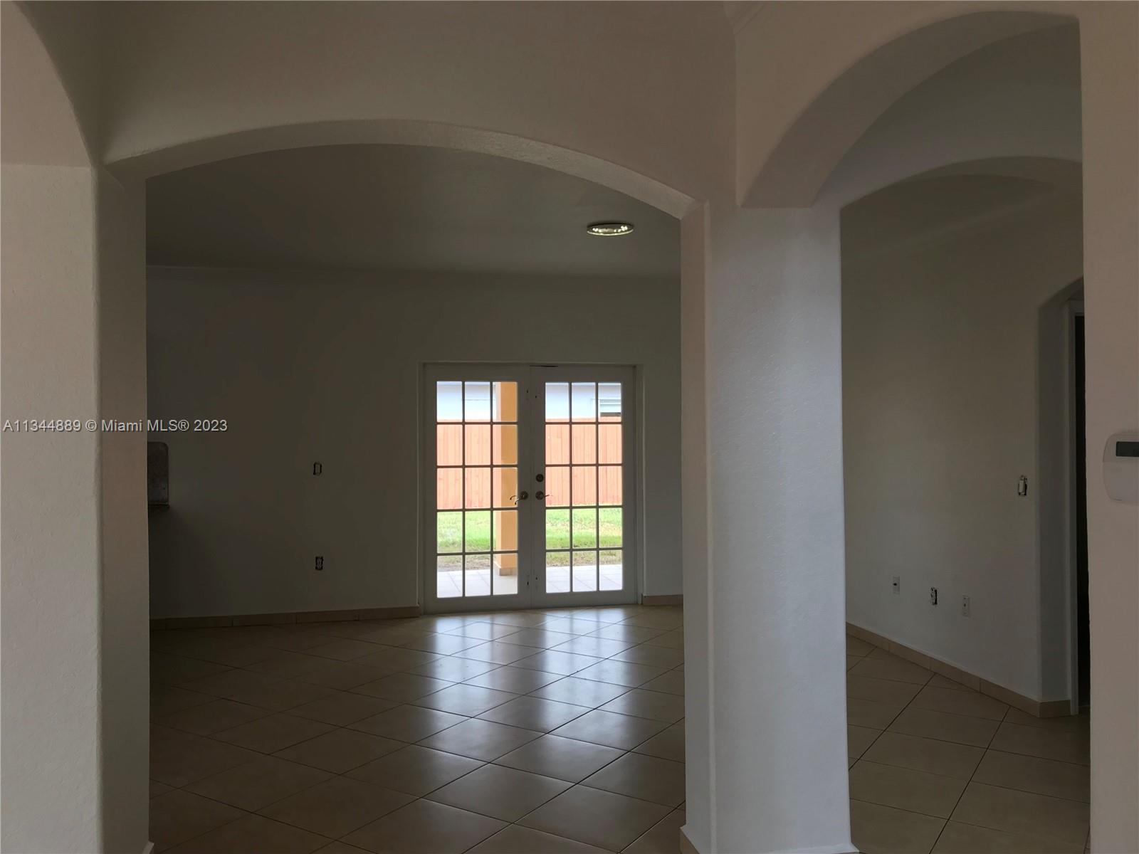 16057 Southwest 53rd Terrace Miami, FL 33185 - Photo 10 of 30 a view of a livingroom with wooden floor