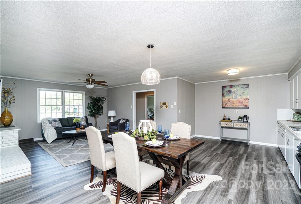 1829 Cathey Road Charlotte, NC 28214 - Photo 12 of 46 a view of a dining room with furniture window and wooden floor