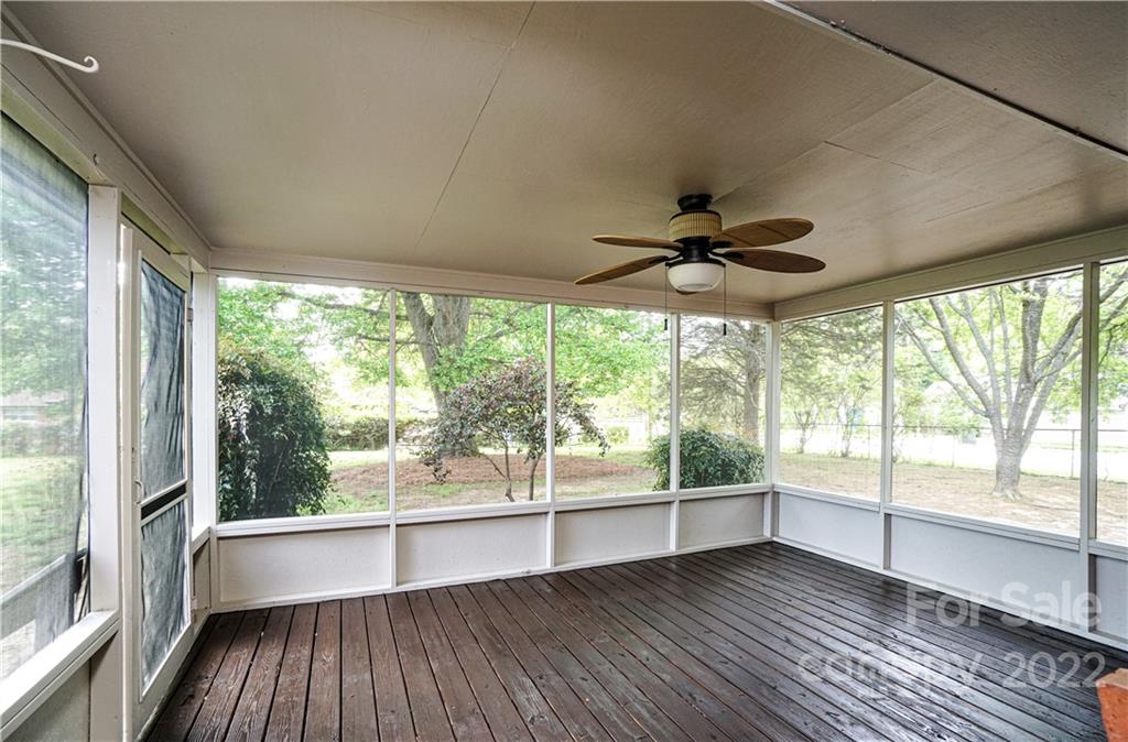 1829 Cathey Road Charlotte, NC 28214 - Photo 16 of 46 a view of an empty room with wooden floor and a window