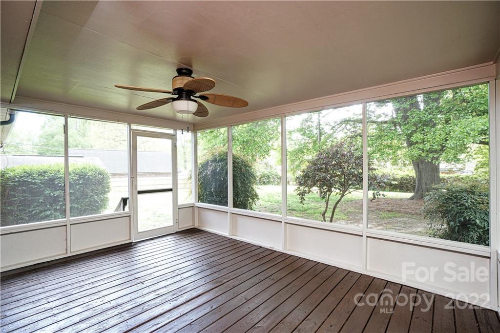 1829 Cathey Road Charlotte, NC 28214 - Photo 18 of 46 a view of empty room with wooden floor and fan