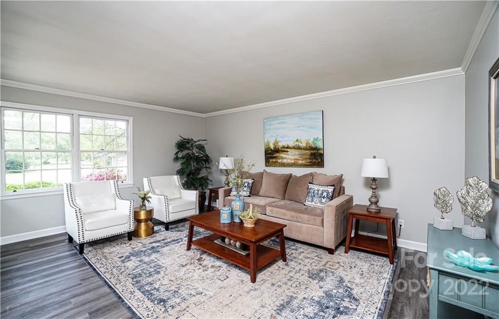 1829 Cathey Road Charlotte, NC 28214 - Photo 20 of 46 a living room with furniture and a potted plant on table