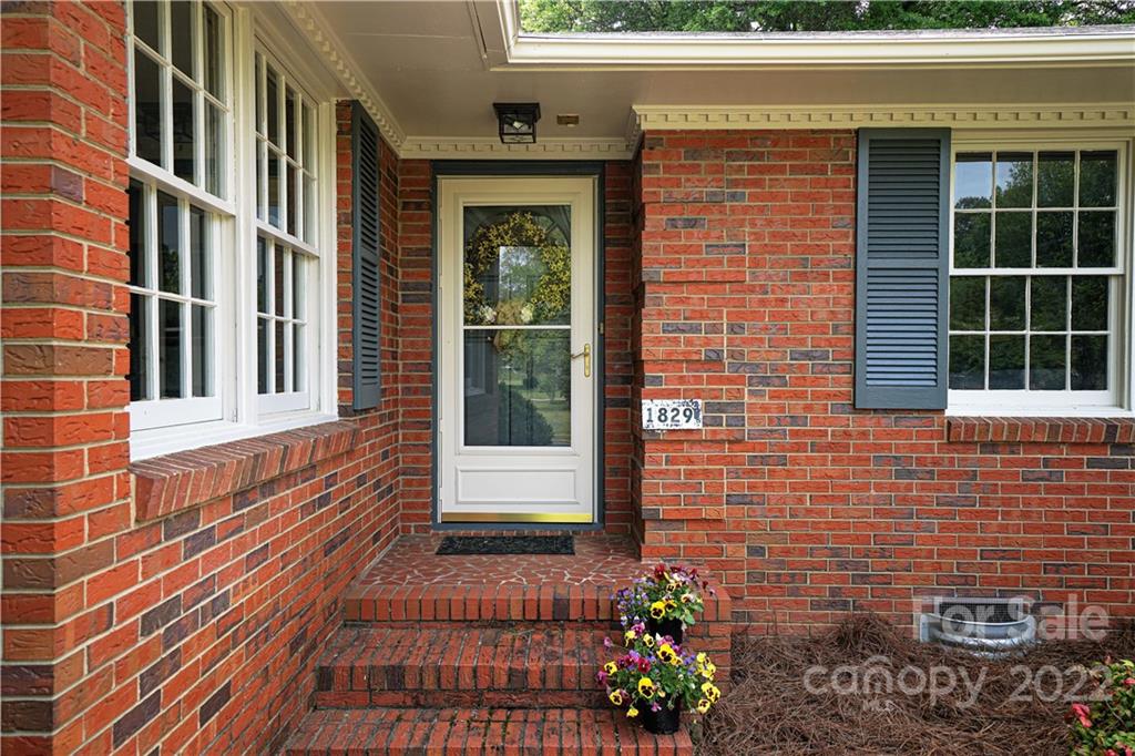 1829 Cathey Road Charlotte, NC 28214 - Photo 2 of 46 a view of a brick house with many windows